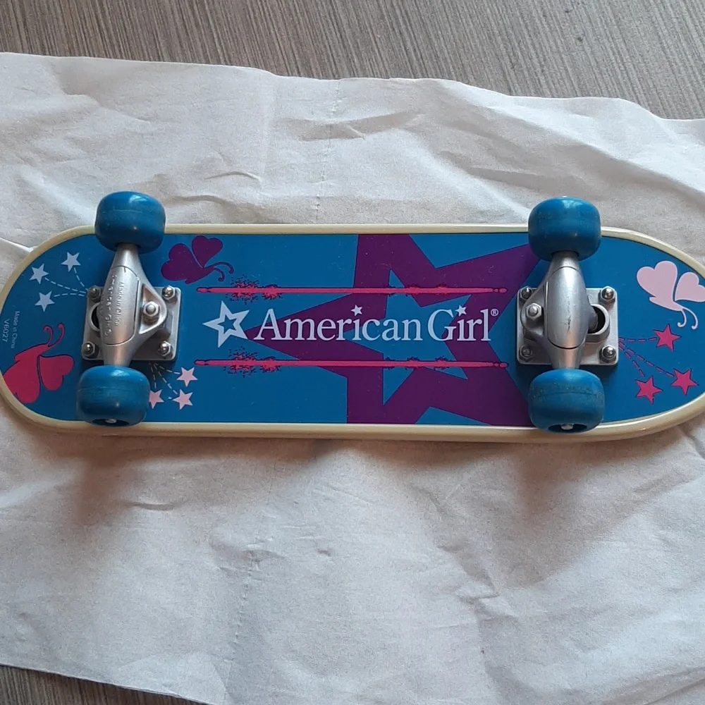 American Girl Skateboard with Blue Wheels